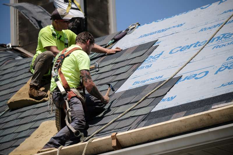 Workers on a roof